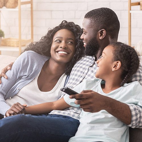 A family gathered around a television, enjoying a movie or show together.