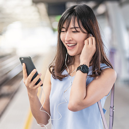 A person wearing headphones, enjoying music and suggesting a sense of focus and relaxation.